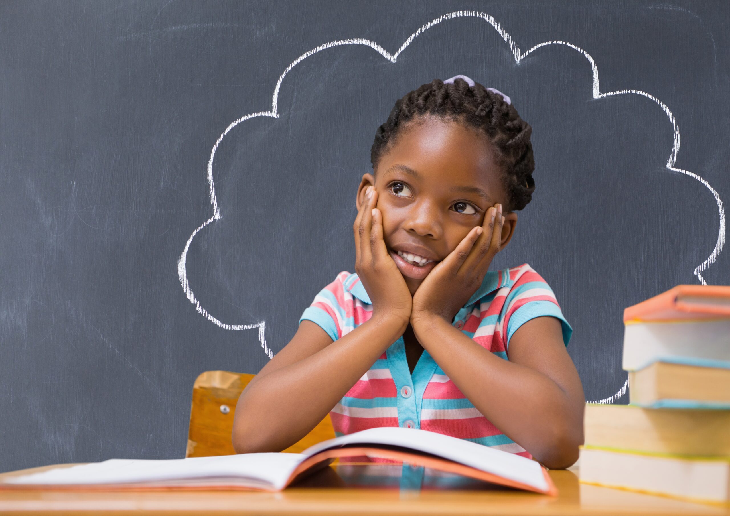 thoughtful girl sitting at desk